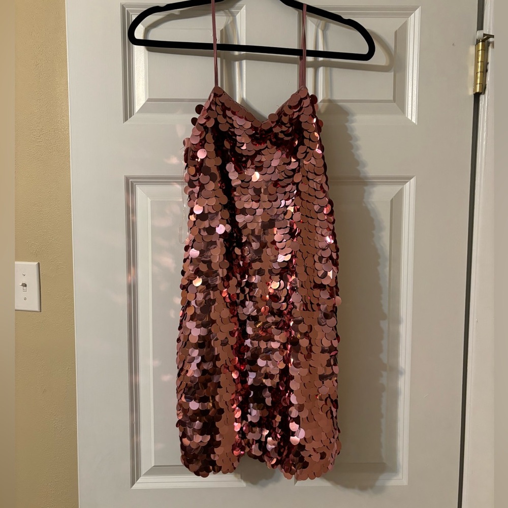 Missing a few sequins up top but not noticed when wearing.